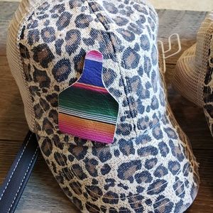 Leopard trucker hat with serape leather ear tag